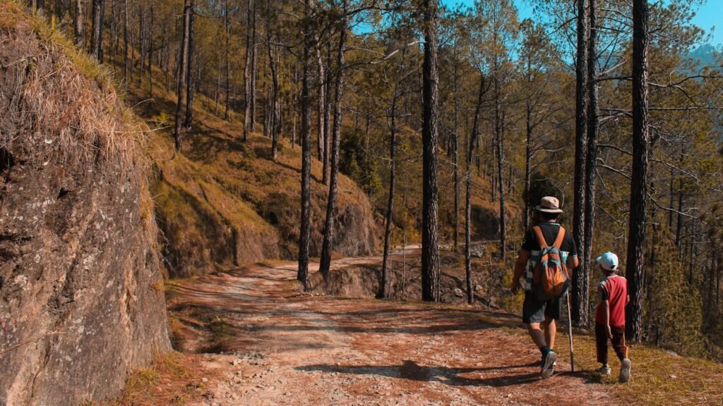 Man and Kid Walking on Downhill