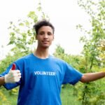 Man Wearing Blue Volunteer Shirt